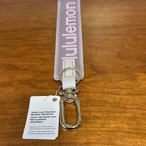 lululemon Never Lost metallic wordmark lavender Keychain NWT